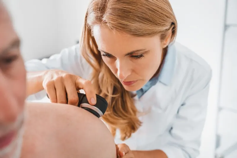 659e4a0bb78c57b22c683af9_dermatologist-examining-a-patient's-skin.jpeg